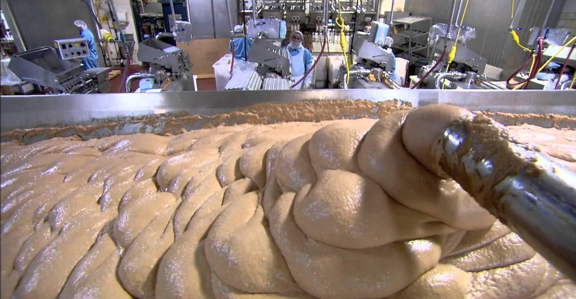 Industrial food processing facility showing processed meat paste